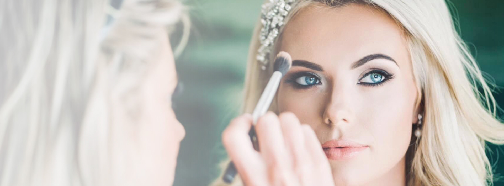 Makeup artist applying eyeshadow with a brush